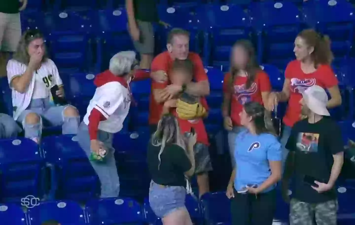 The father was initially thrilled to have caught the ball for his son (ESPN)