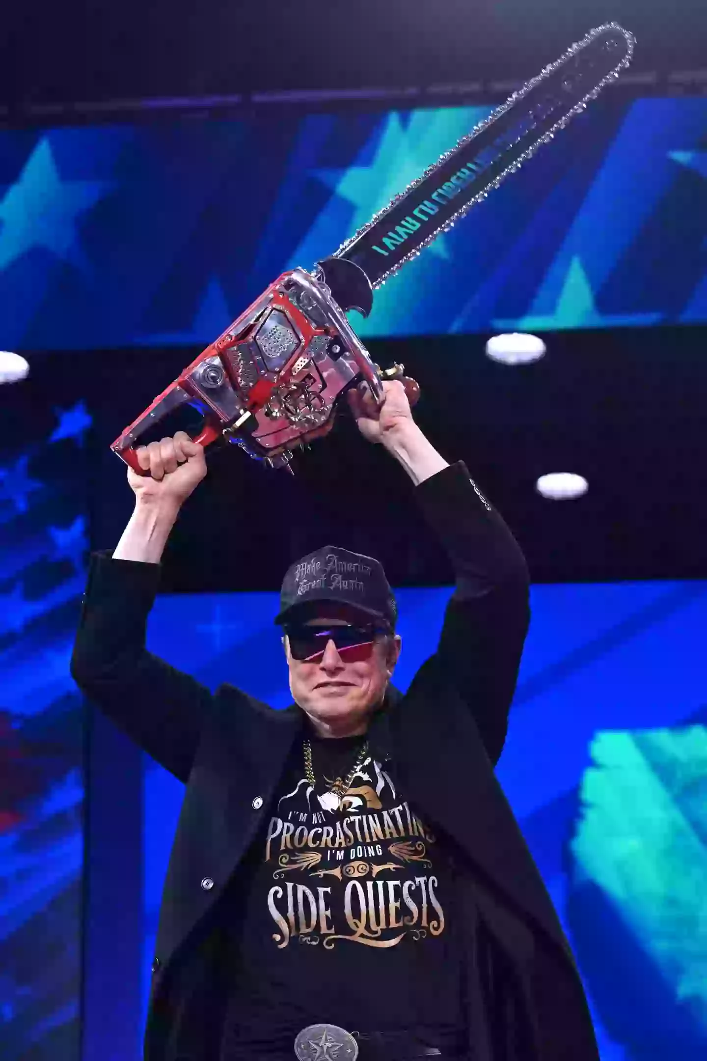 Elon Musk's chainsaw read 'Long live freedom, damn it' (SAUL LOEB/AFP via Getty Images)