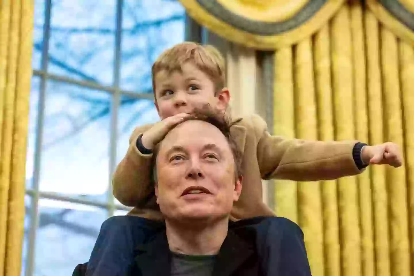 Musk and his son X Æ A-Xii in the Oval Office (JIM WATSON/AFP via Getty Images)
