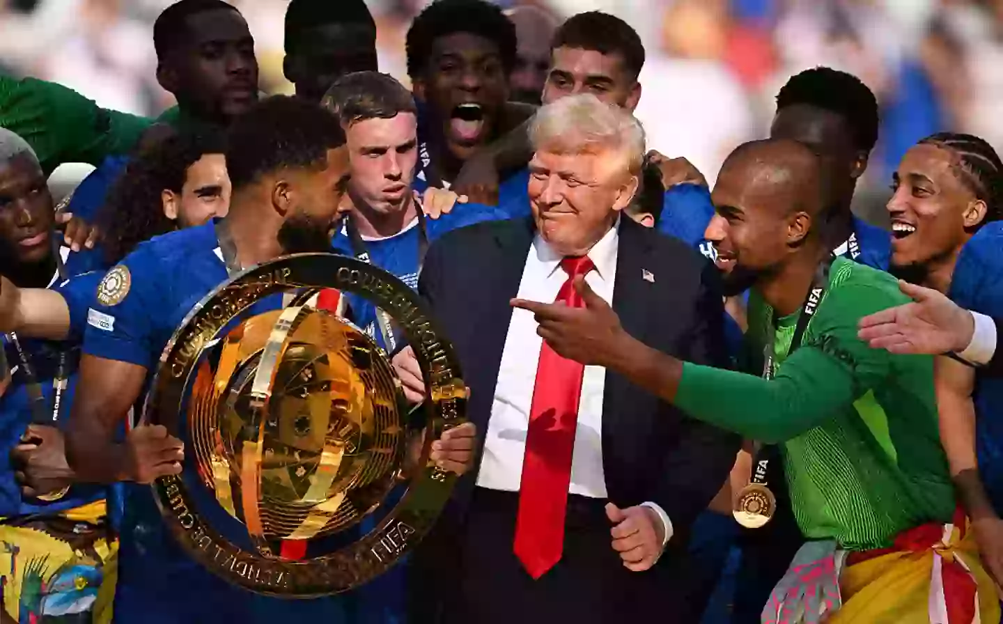 Donald Trump stayed with the football team as they celebrated their win (David Ramos/Getty Images)