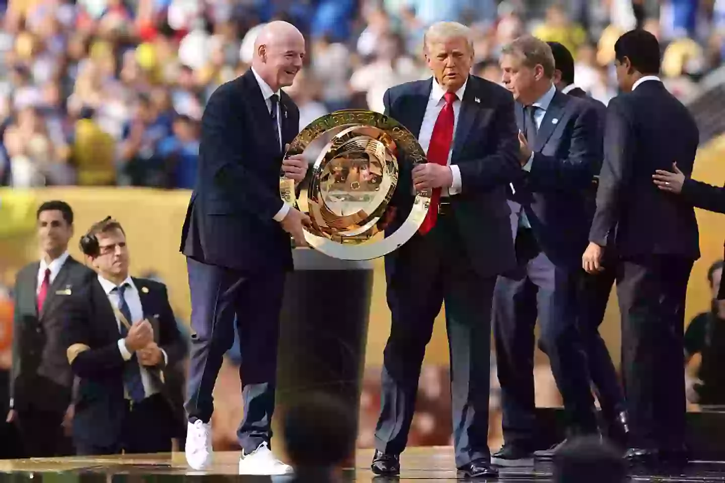 Trump handed the team a replica trophy (Alex Grimm/Getty Images)