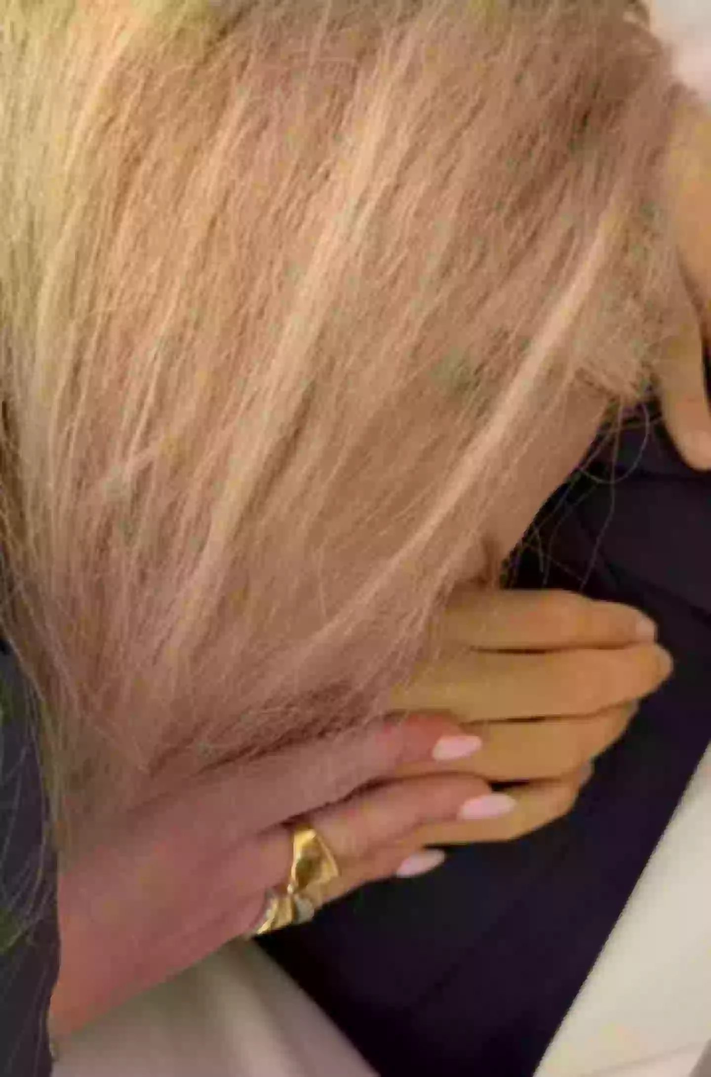 She could be seen crying and kissing his hands (mrserikakirk/Instagram)