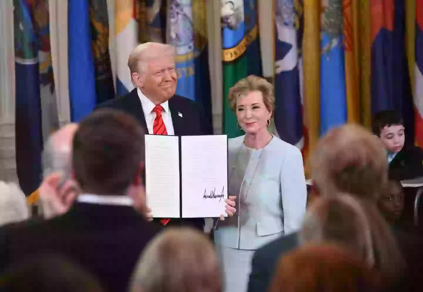 Trump pictured with U.S. Education Secretary Linda McMahon (Chen Mengtong/China News Service/VCG via Getty Images)