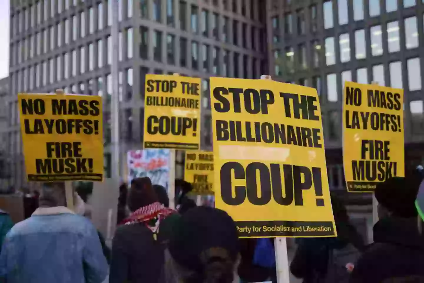 Demonstrators gather outside of the Office of Personnel Management in Washington, DC on February 7, to protest federal layoffs and demand the termination of Elon Musk from the Department of Government Efficiency (BRYAN DOZIER/Middle East Images/AFP via Getty Images)