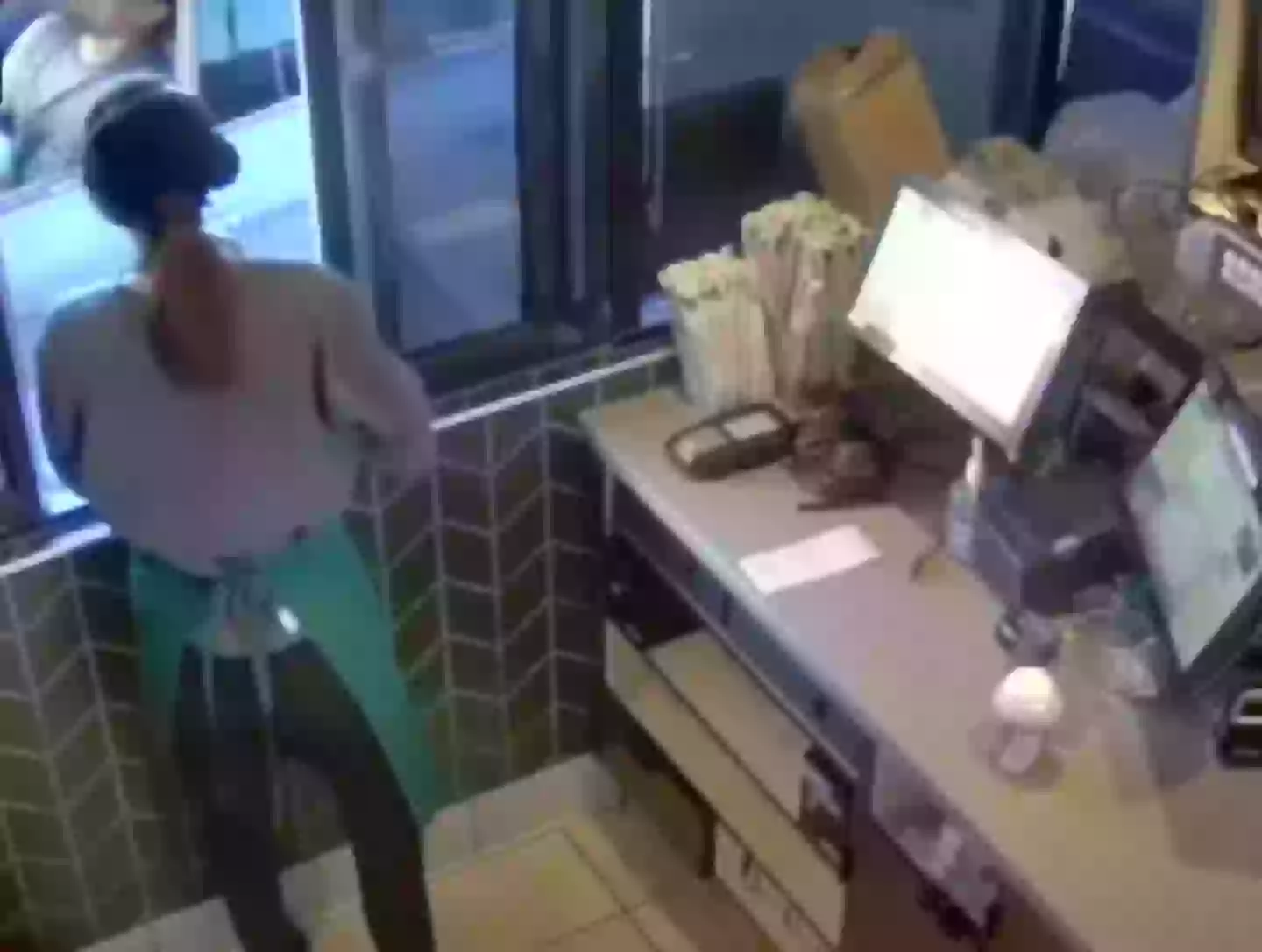 The security footage shows Garcia writhing in pain as the tea spills on him (KCAL News)