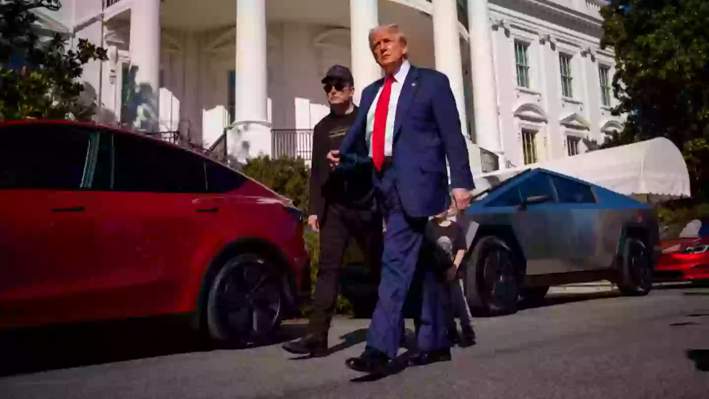 People shocked to learn what was written on Donald Trump's paper as he bought Tesla to support Elon Musk's 'baby'