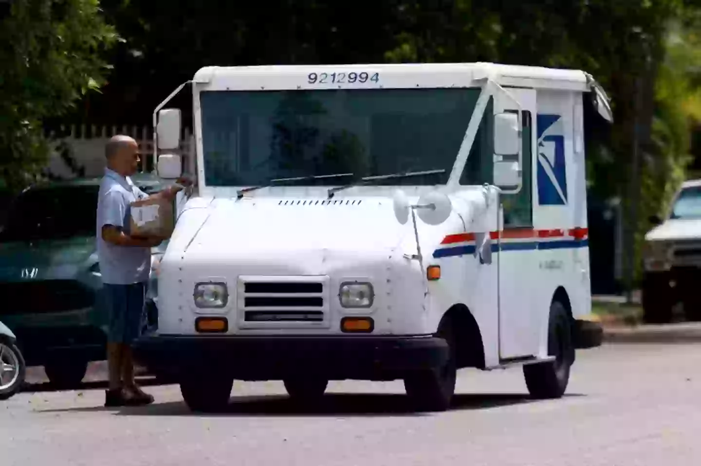 The USPS carries packages on the 'last mile' of their journey for millions of rural Americans (Joe Raedle/Getty Images)