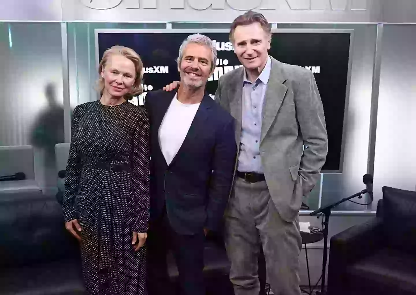 Pamela Anderson, Andy Cohen, and Liam Neeson pictured on July 30 (Cindy Ord/Getty Images for SiriusXM)
