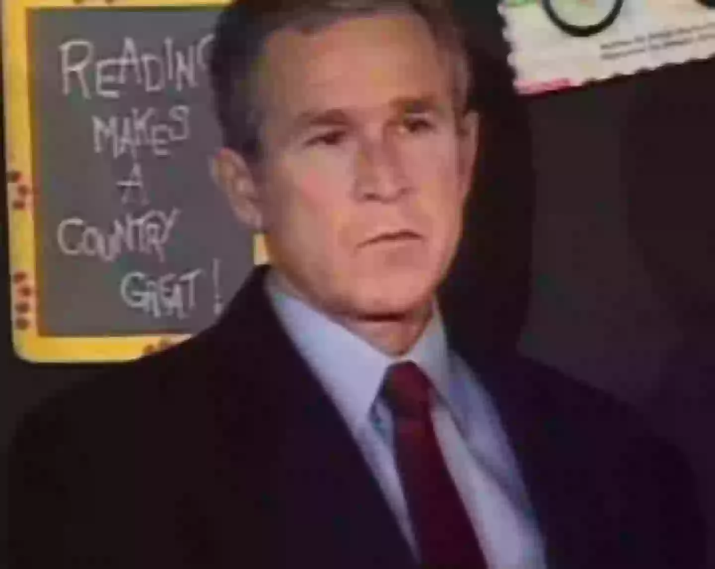 President George W. Bush sat in the classroom as he was given the news (WFLA News Channel 8/YouTube)