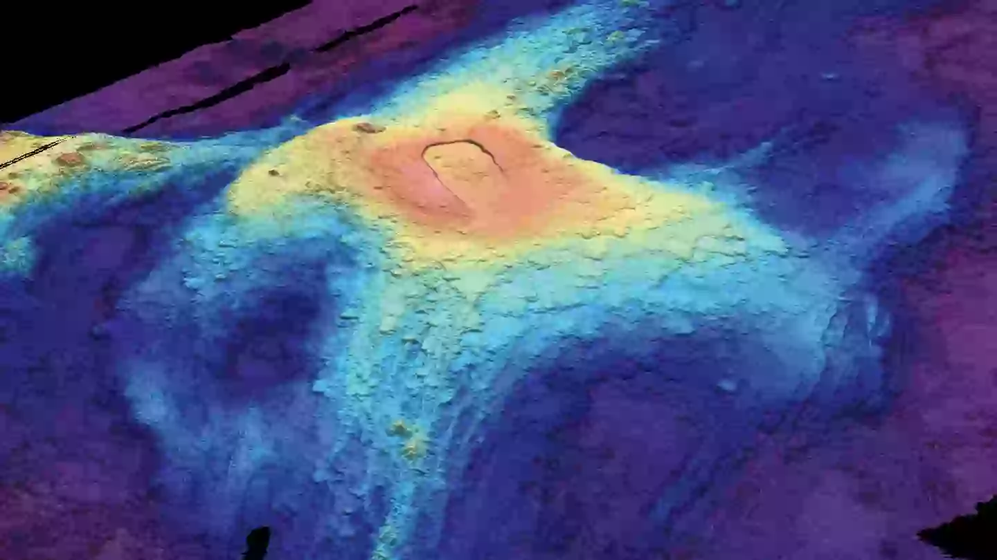 A 3-D bathymetric seafloor map of Axial Seamount in July 2014 shows lava flows from previous eruptions. Red indicates lava at the highest elevation above the seafloor, while dark blue at the edges shows where lava flow was thinnest (Susan Merle/Oregon State University)
