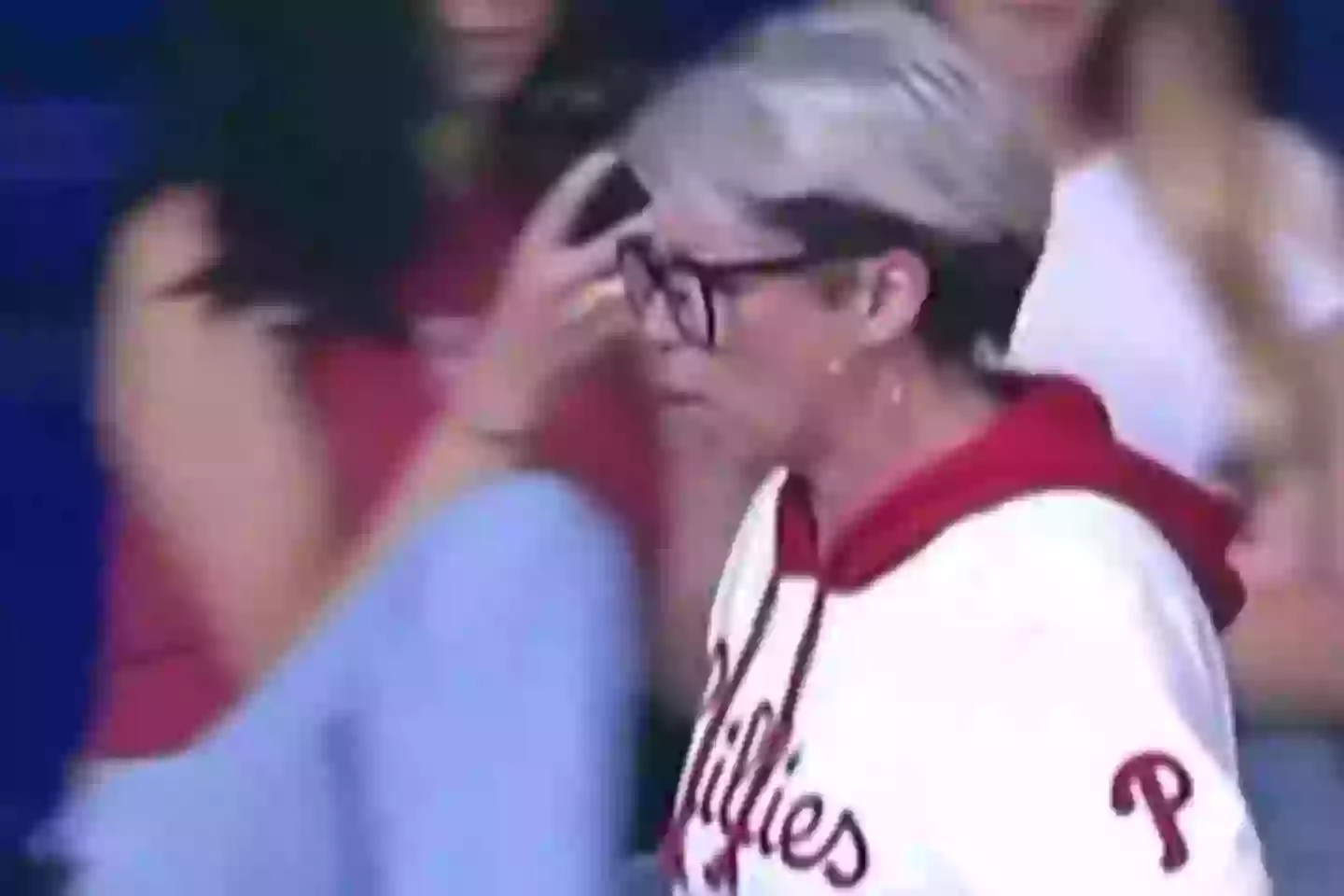 The fan strode back to her seat with the ball (