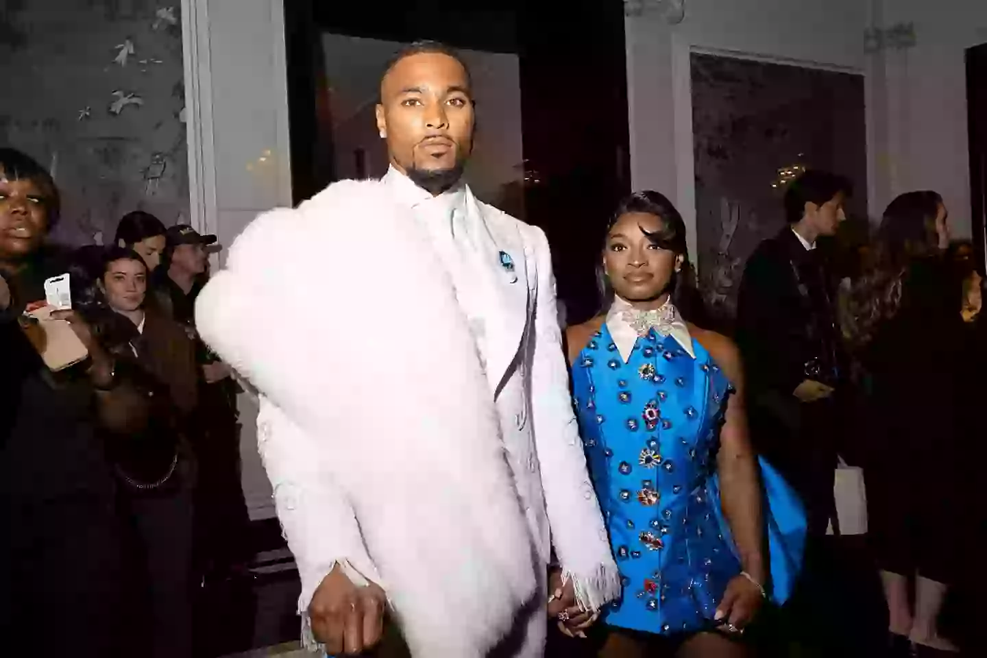 Biles with her husband, NFL star Jonathan Owens (Lanna Apiskuh/WWD via Getty Images)