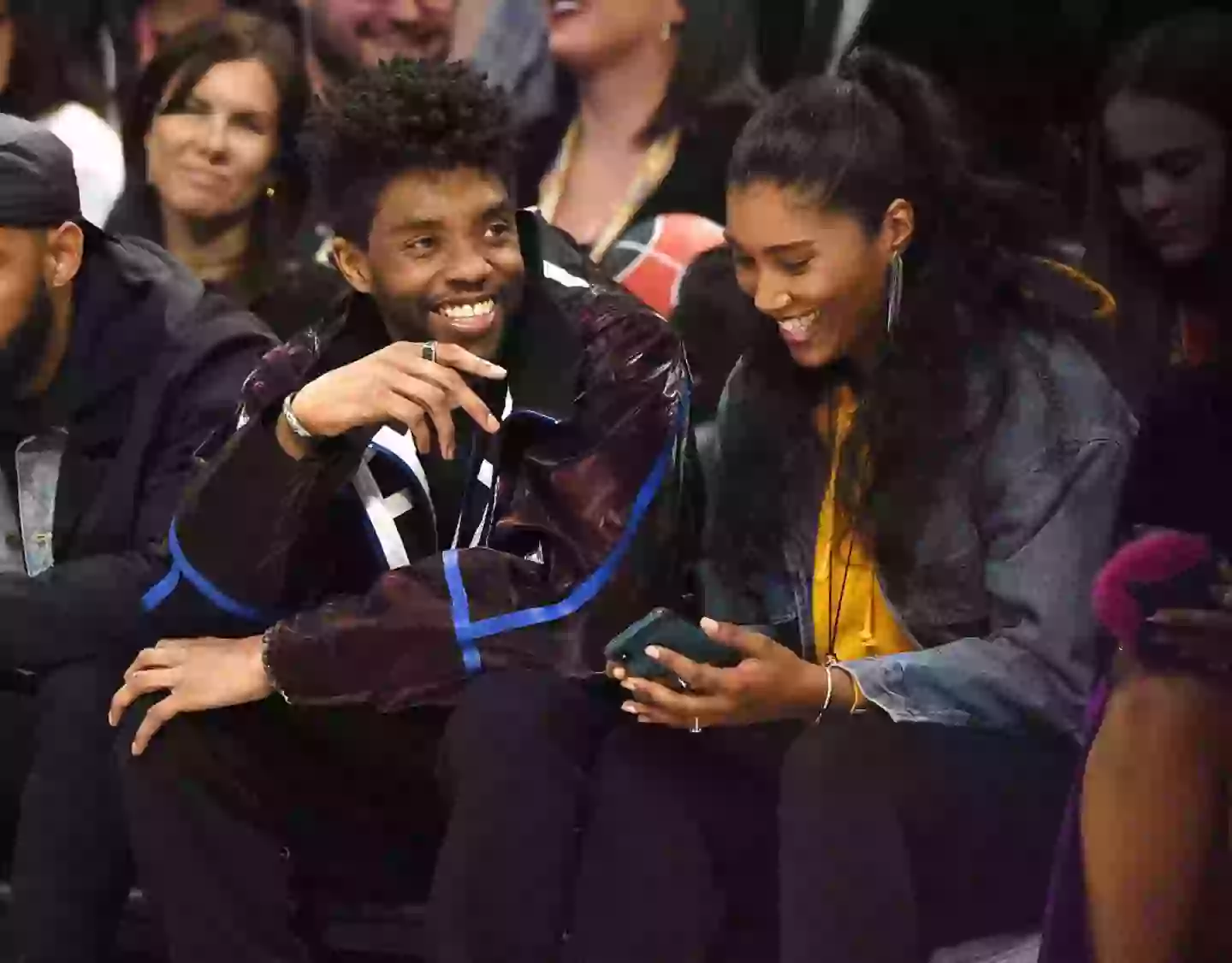 The late Chadwick Boseman pictured with his wife watching basketball (Kevin Mazur/Contributor/Getty)