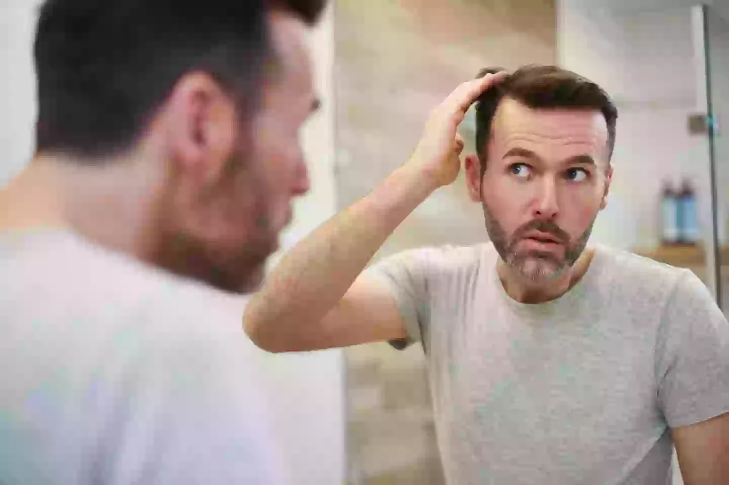 Energy drinks and sodas could be increasing the risk of hair loss in men(Getty Stock Image)