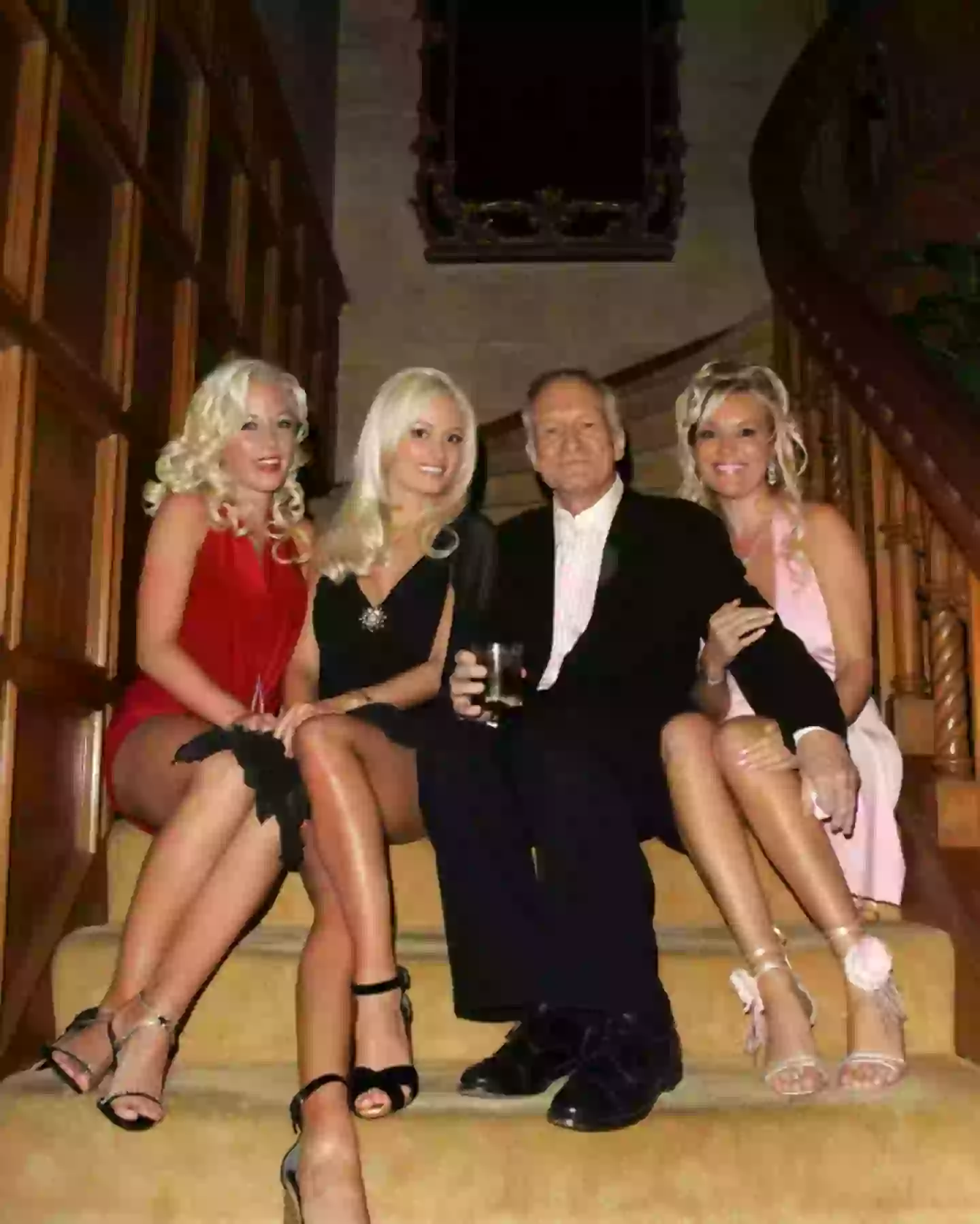 Kendra (far left) shared Hugh Hefner with his other two girlfriends (Getty Images)