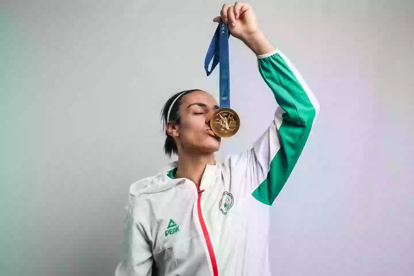 Imane Khelif poses for a portrait with her gold medal after winning the Boxing Women's 66kg Final. Image credit: Getty