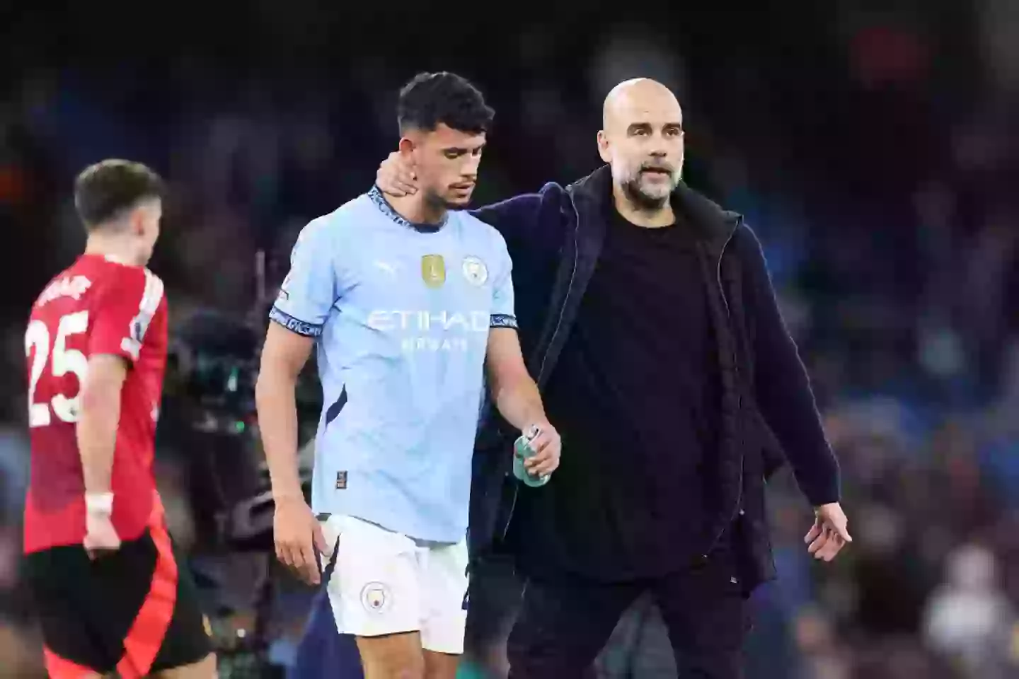 Pep Guardiola consoles Matheus Nunes after Man City's 2-1 defeat to Man Utd (Image: Getty)