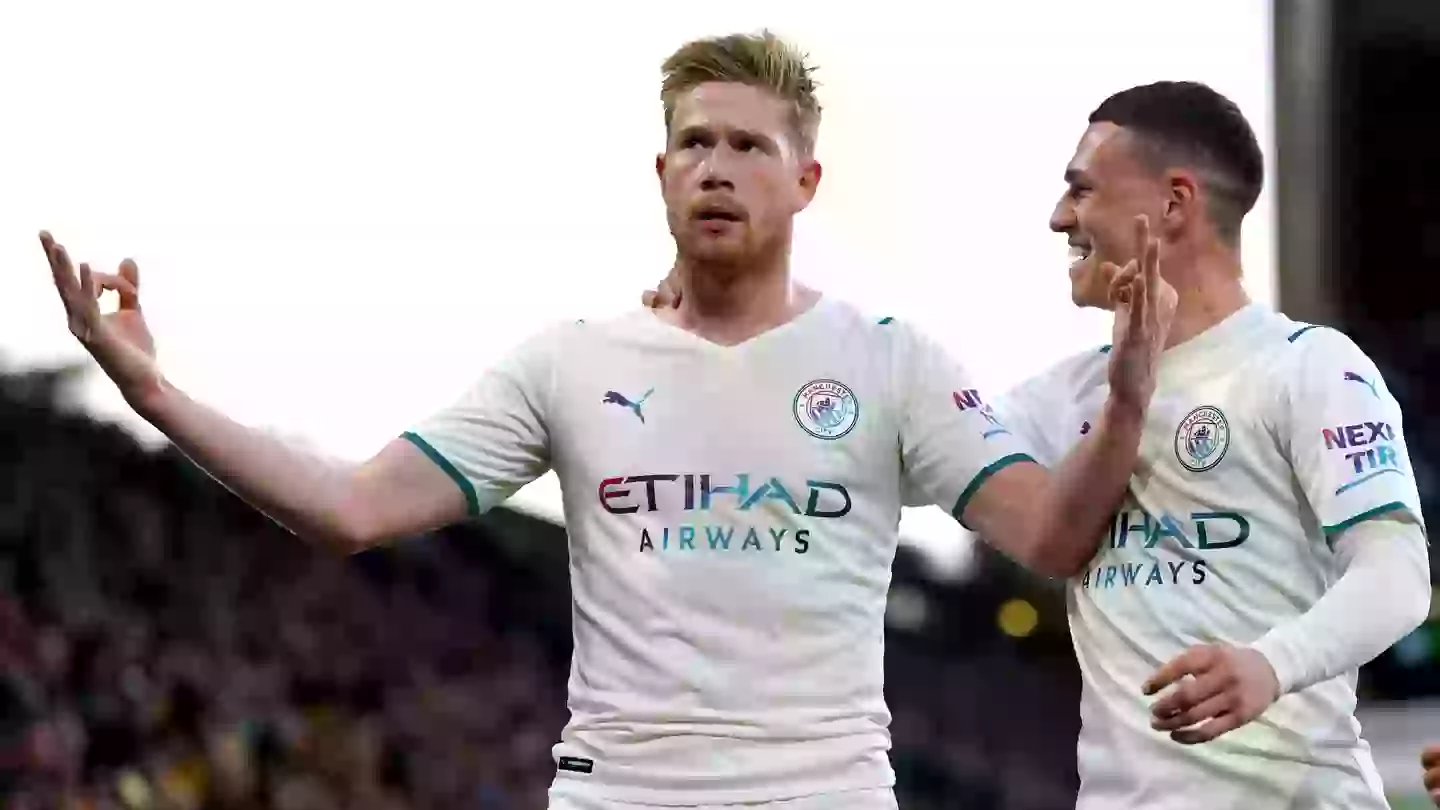 Kevin De Bruyne (left) celebrates scoring their side's third goal of the game and completing his hat-trick during the Premier League match at the Molineux.