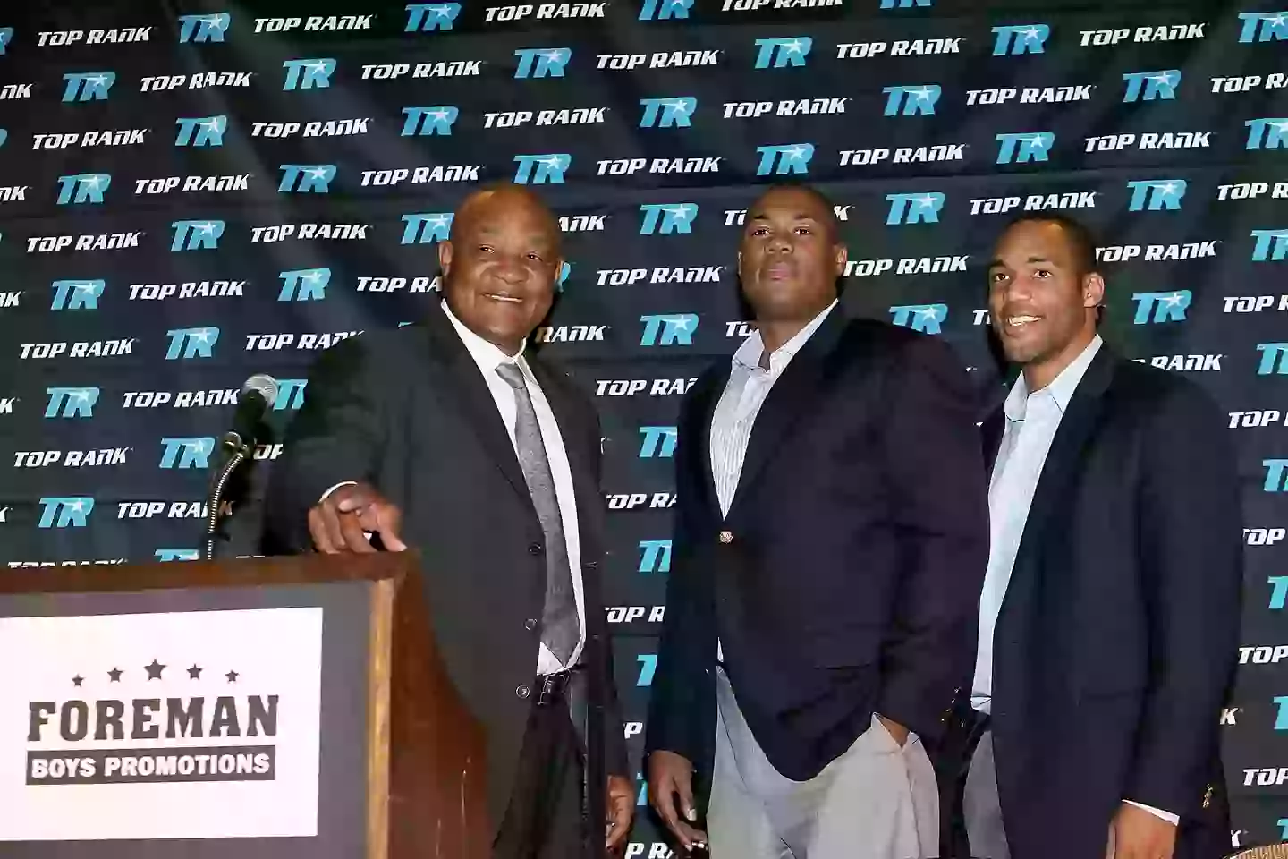 George Foreman and two of his sons with the same name. Image: Getty