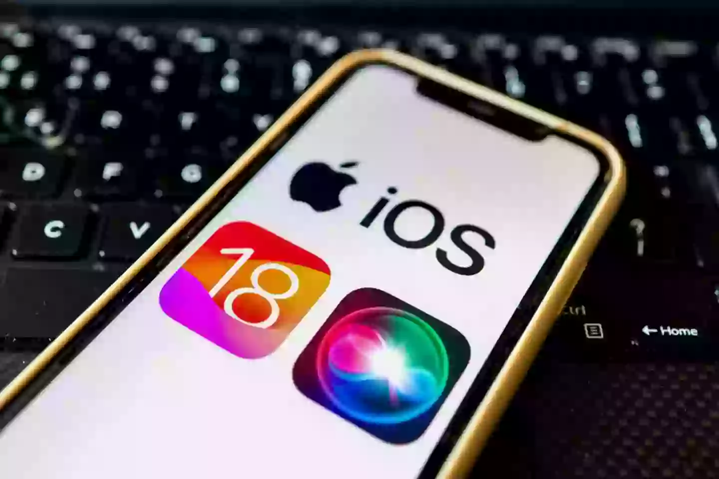 Apple iOS 18 and Siri AI assistant logo seen displayed on an Apple iPhone (Getty Images)