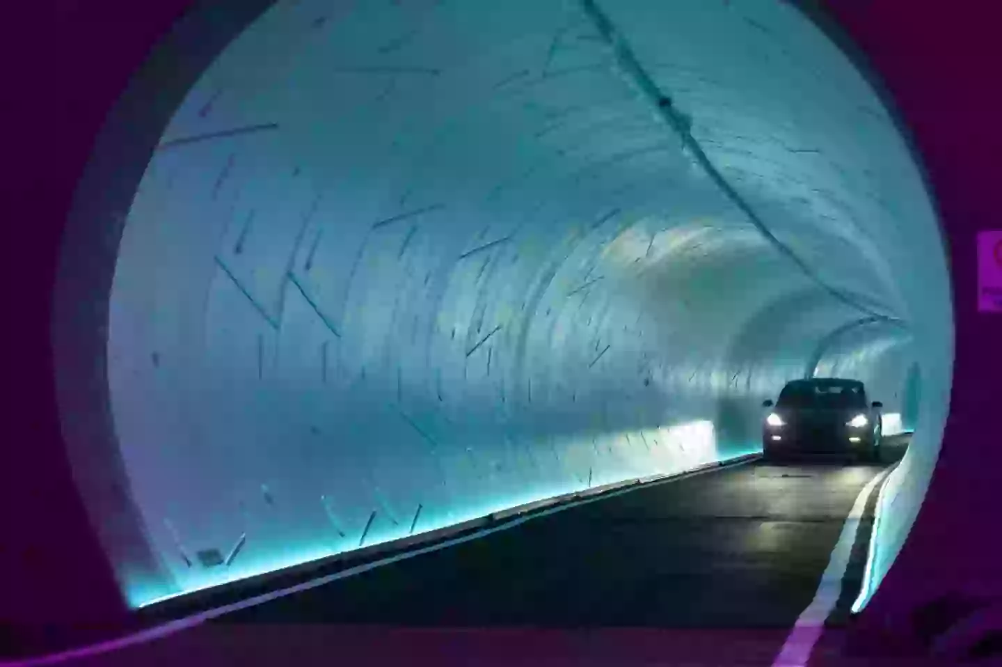 A Tesla EV passes through an underground tunnel (Las Vegas / Bloomberg / Contributor / Getty)