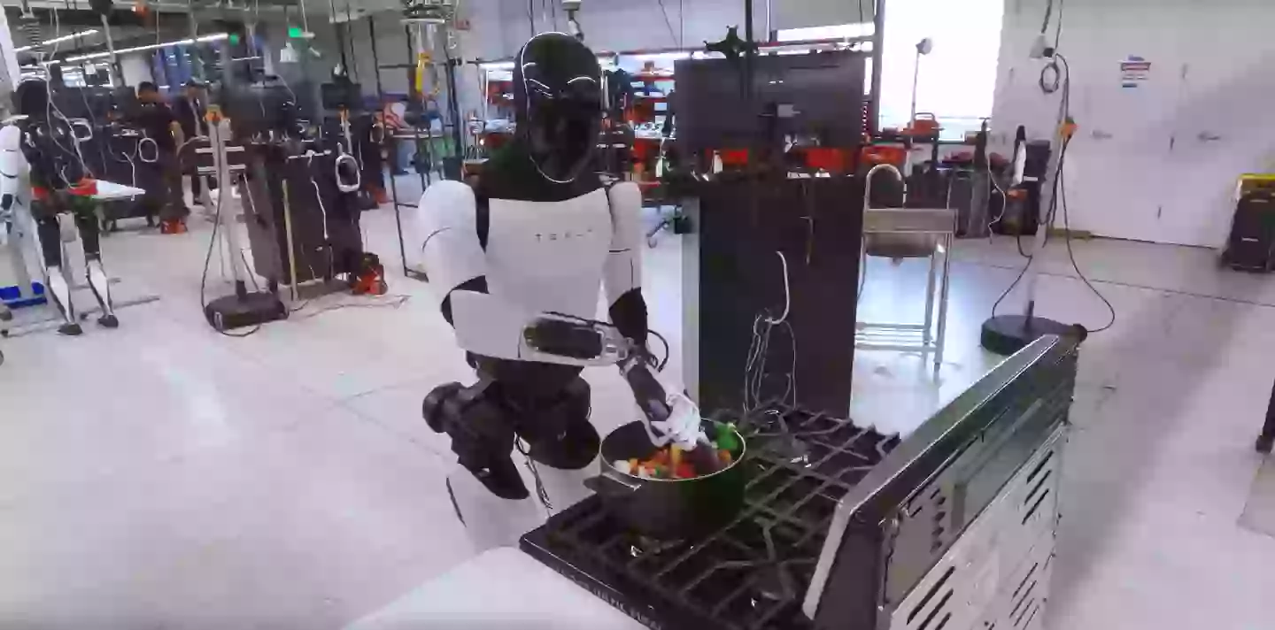 Tesla Bot Chef Eerie footage showing Tesla's humanoid robot 'cooking dinner' is ...