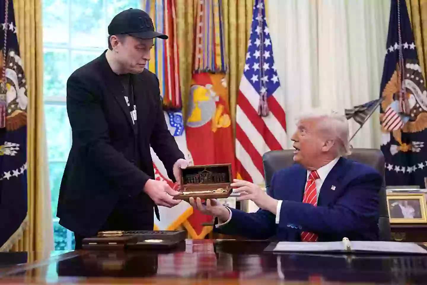 Elon Musk receiving a key from President Donald Trump (Getty Images)