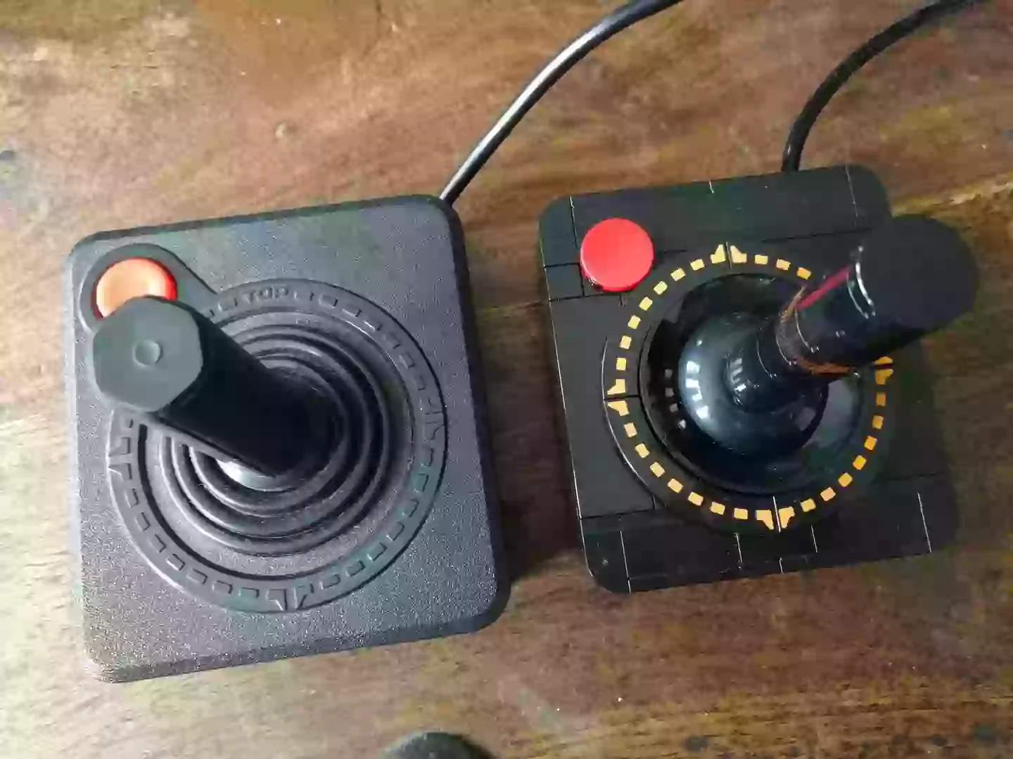 An Atari CX40 next to the Lego CX10 model /