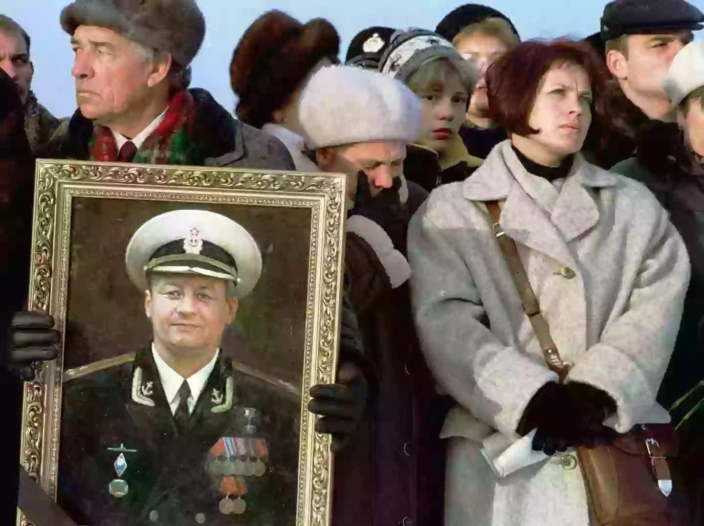 The wife of Captain-Lieutenant Dmitri Kolesnikov pictured during a memorial ceremony (AFP via Getty Images)