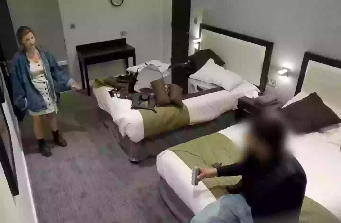 The man followed Ellie back to her hotel room.