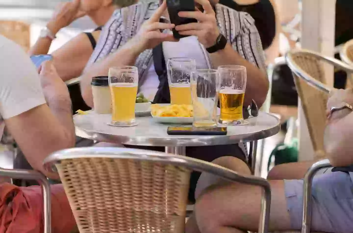 Not much beats lounging around with your mates on holiday, with a cold drink in hand (Getty Stock Image)