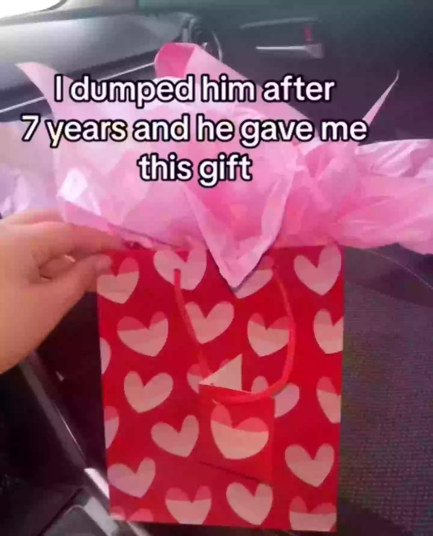 Wrapping the gift up and placing it in a love heart covered bag was certainly a choice (TikTok/@jessica.xyc)