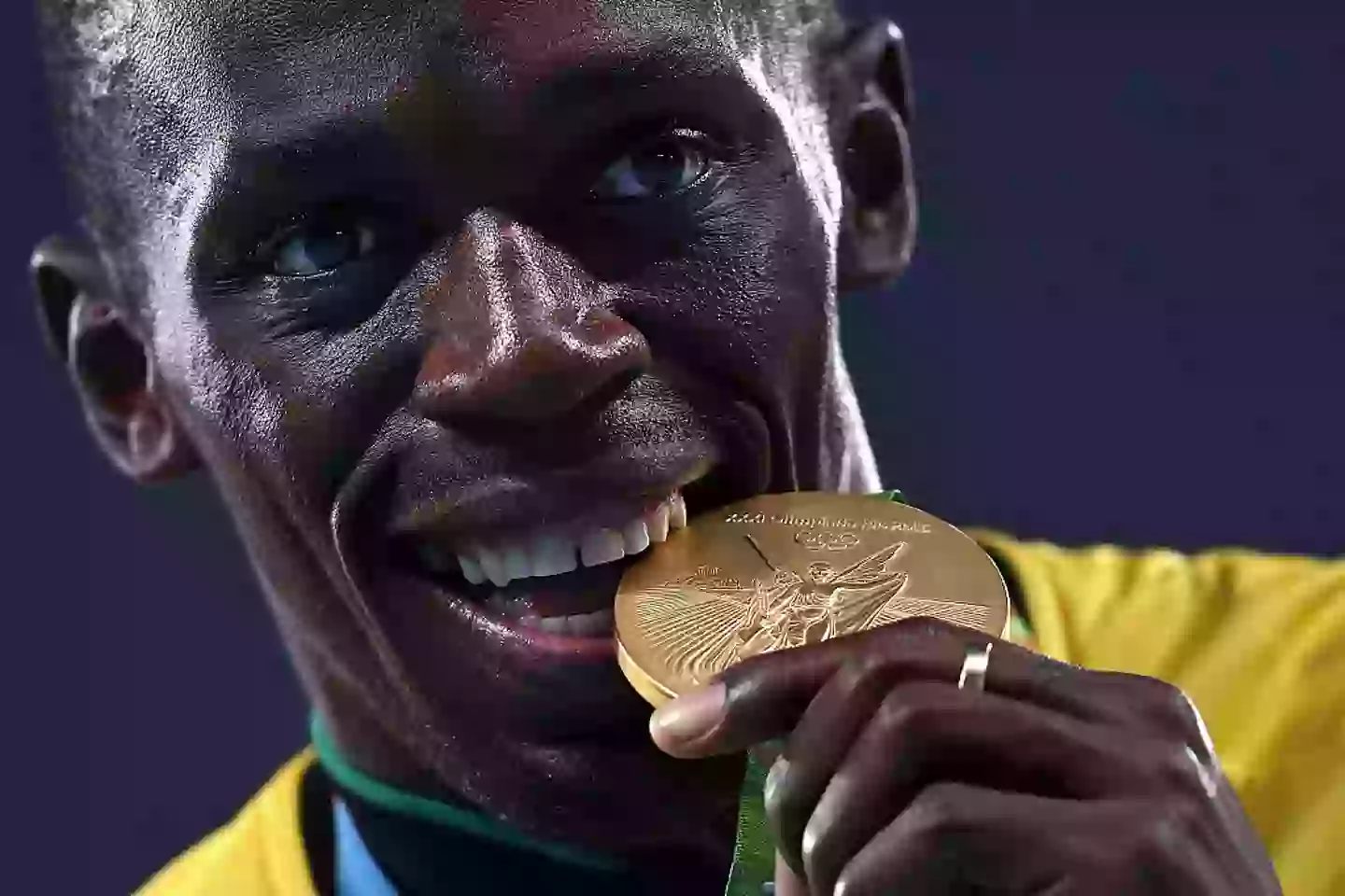 Usain Bolt biting one his golds in the 2016 Games (Patrick Smith/Getty Images)