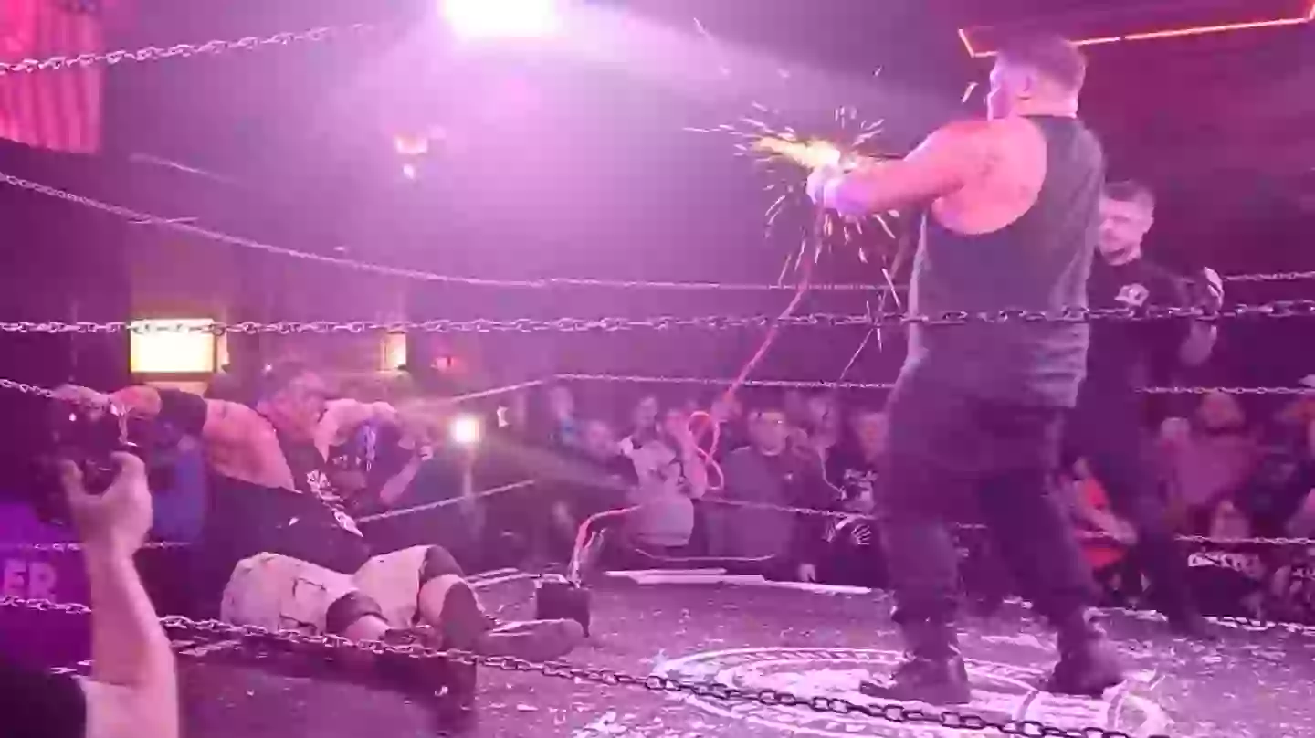 Sparks flew from the jump leads before Isaac appeared to start convulsing (X/@BritWresAwayDay)