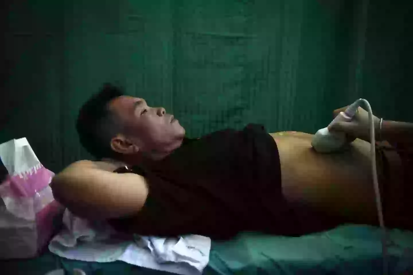 A man pictured in 2017 while undergoing an ultrasound to see if he has been infected with the parasites (LILLIAN SUWANRUMPHA/AFP via Getty Images)