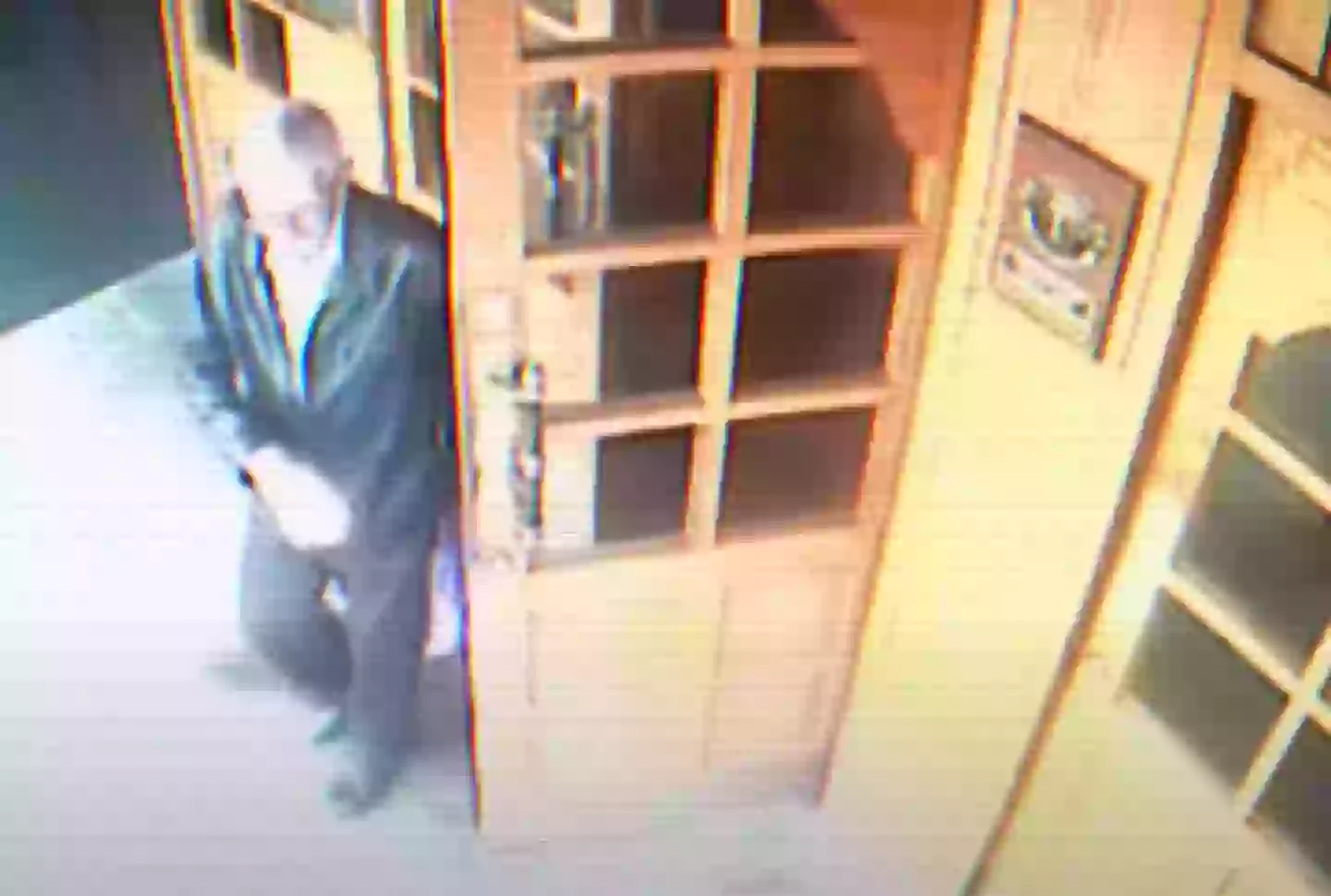 Bergmann seen on one of the occasions he left the hotel with a purple plastic bag (YouTube/@AeonVideo)