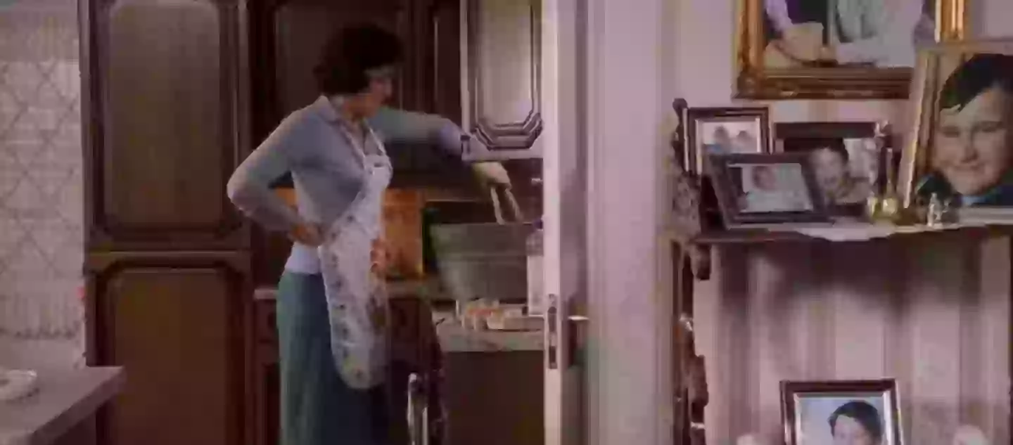 Aunt Petunia is mixing Harry's clothes in the background.