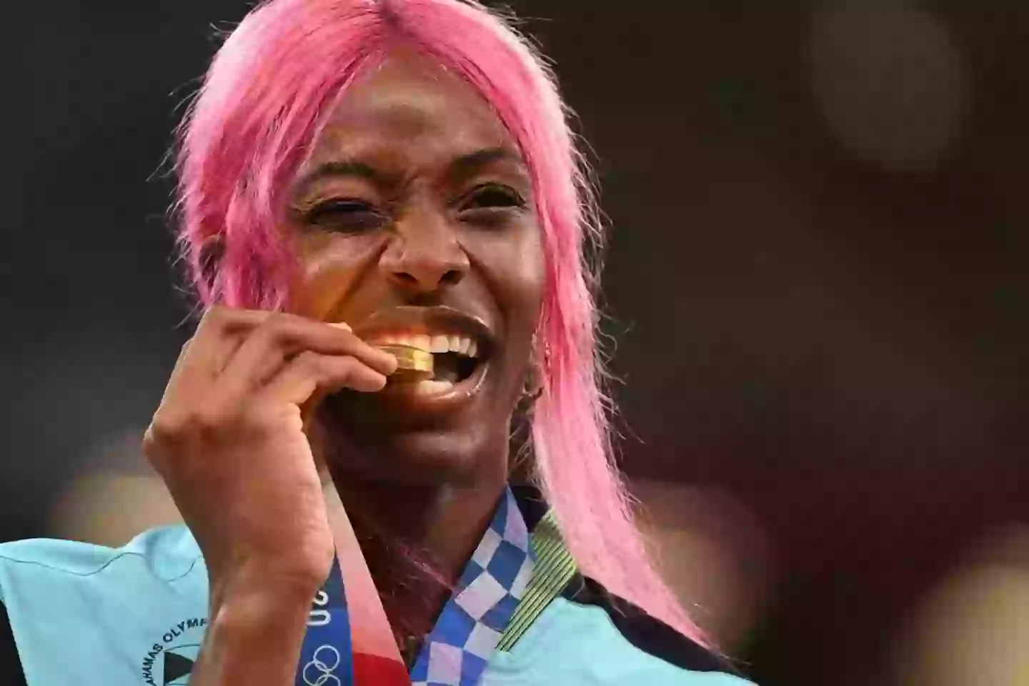 Bahamas gold medallist Shaunae Miller-Uibo bites her medal in the 2020 Games (INA FASSBENDER/AFP via Getty Images)