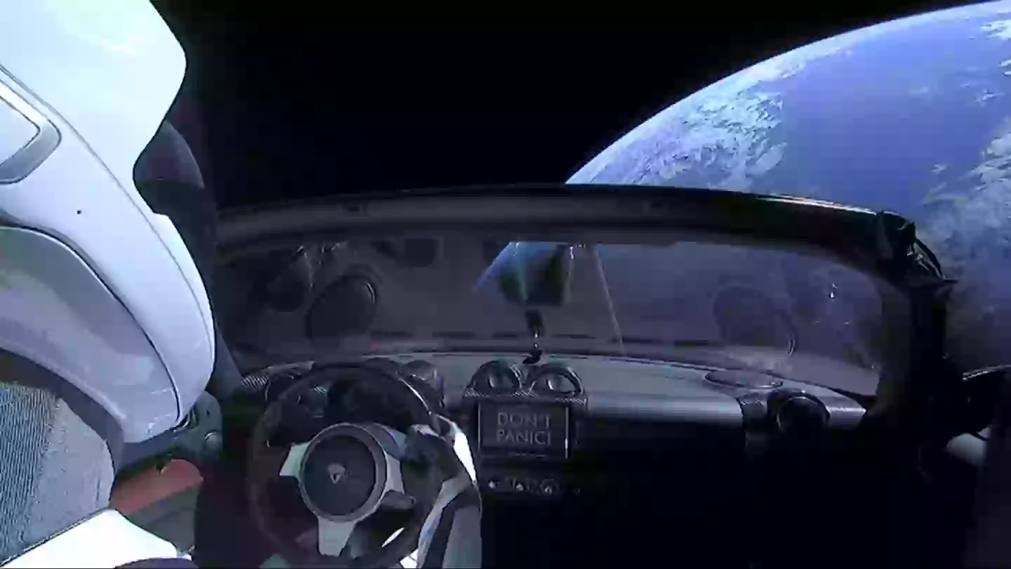 The car was kitted out to be the 'silliest' thing you could put in space, so it's got a mannequin in a space suit, a Hot Wheels and a classic book. (SpaceX via Getty Images)