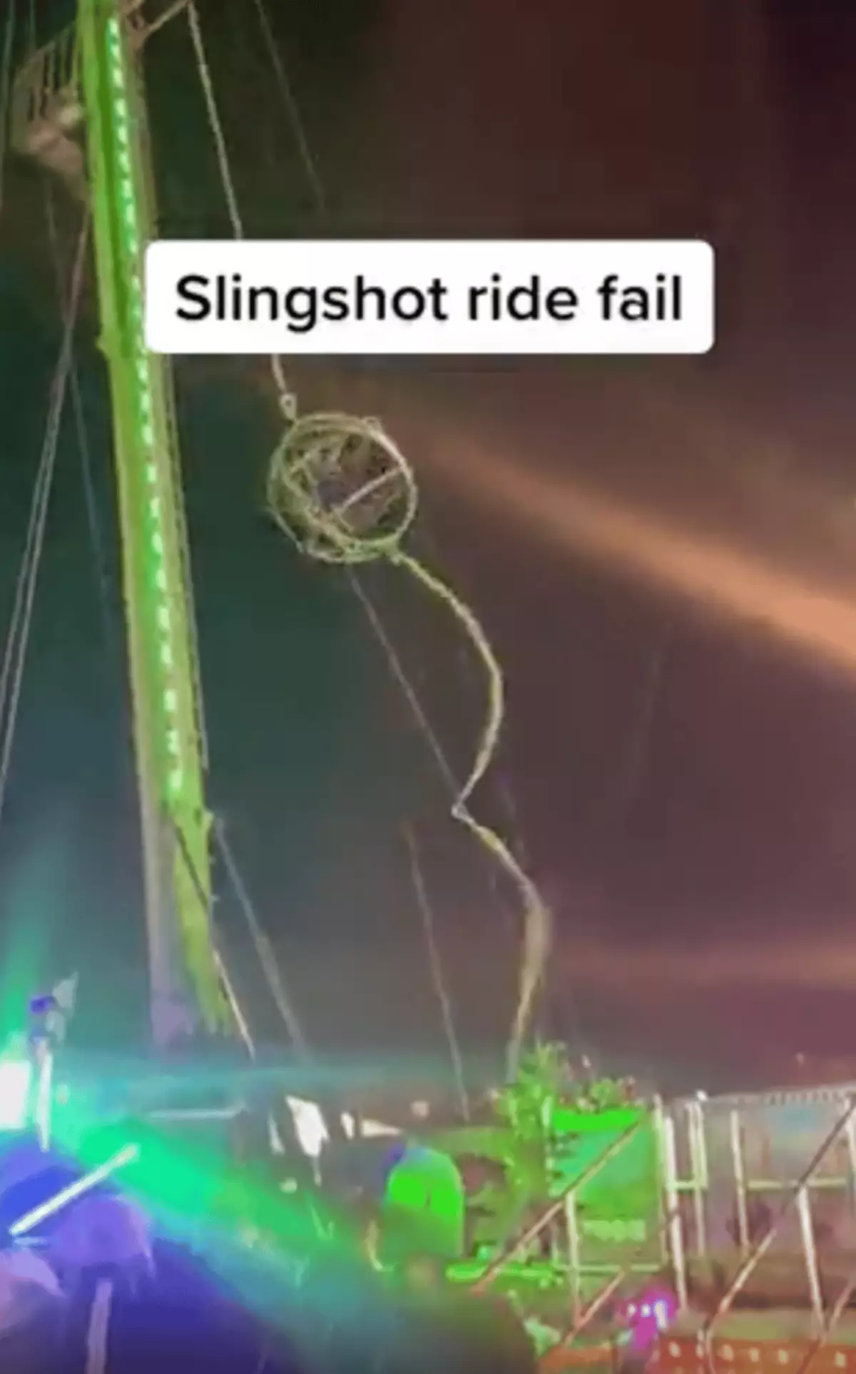 Slingshot Ride Snaps Slingshot ride snaps at London's Winter Wonderland while two people are ...
