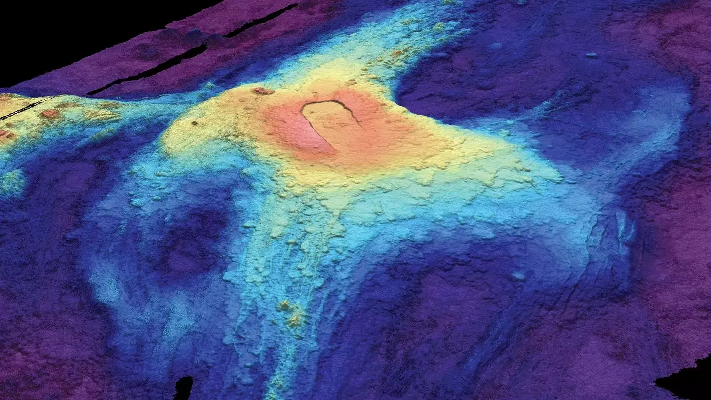 A 3-D bathymetric seafloor map of Axial Seamount in July 2014 shows lava flows from previous eruptions. Red indicates lava at the highest elevation above the seafloor, while dark blue at the edges shows where lava flow was thinnest (Susan Merle / Oregon State University)