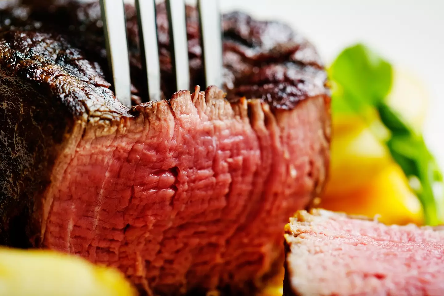 A cut of medium-rare steak - RapidEye via Getty Images