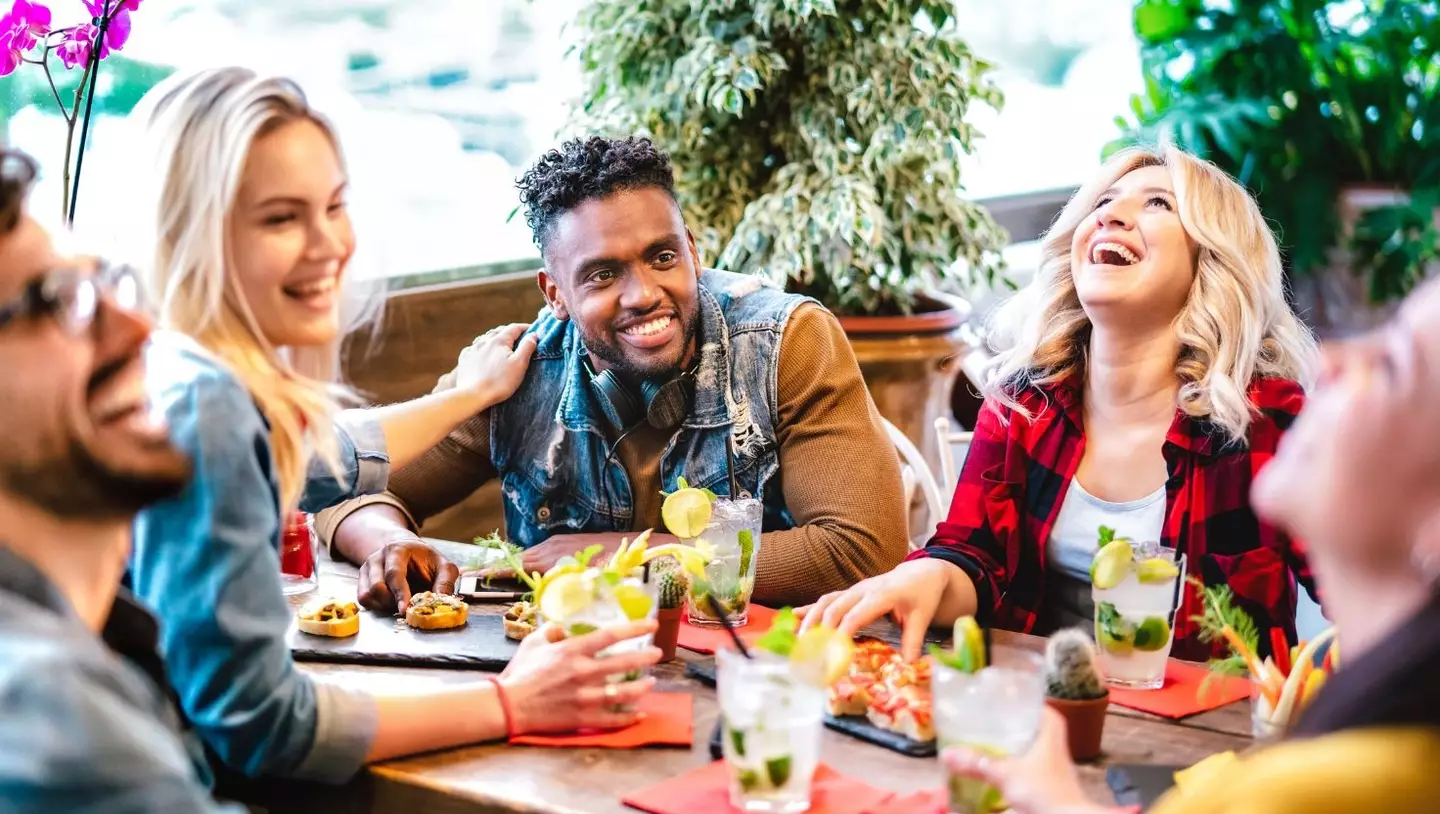 Gen Z are more likely to choose communal dining over Baby Boomers, research suggests (Getty Stock Image)