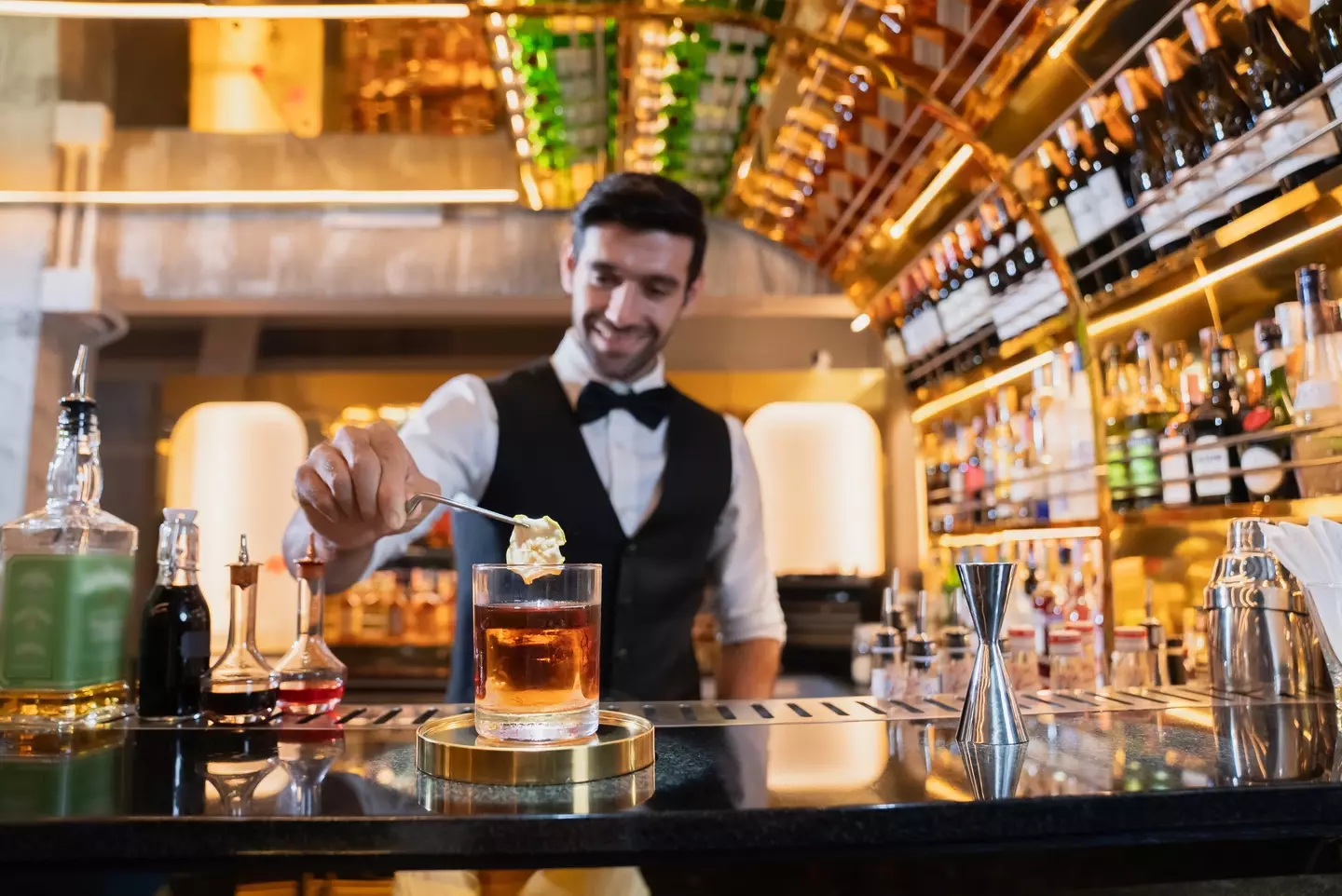 Bartender prepares a whisky - Me 3645 Studio via Getty Images