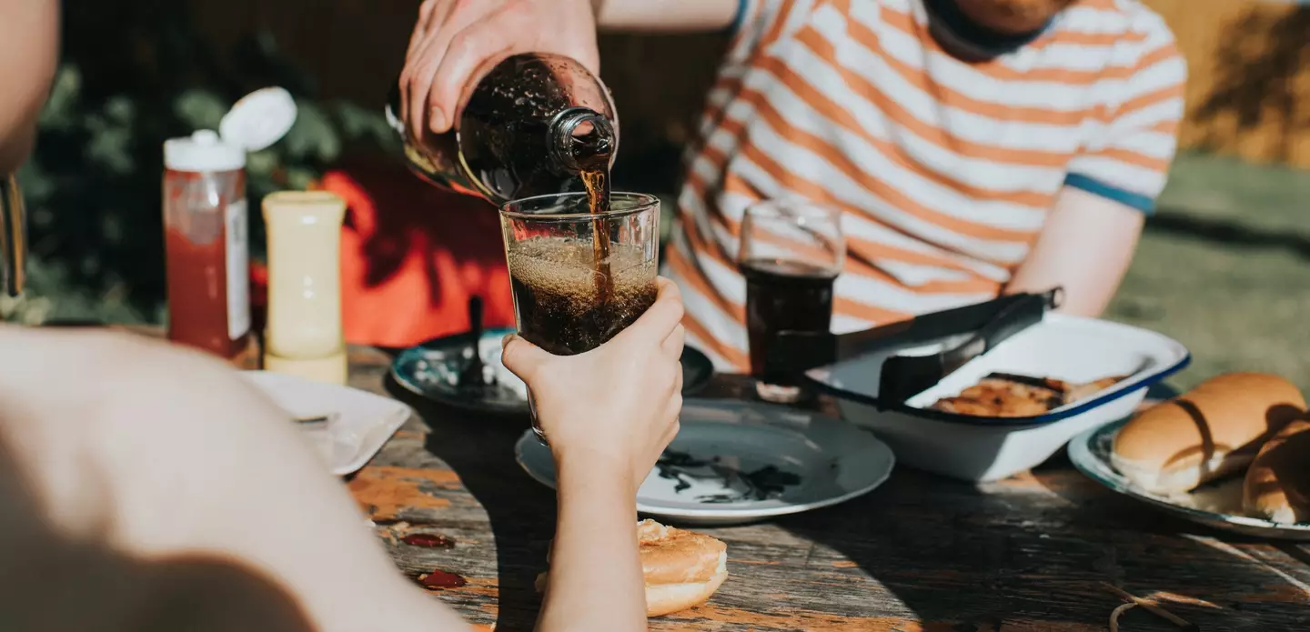 Friends sharing some cola - Catherine Falls Commercial via Getty Images