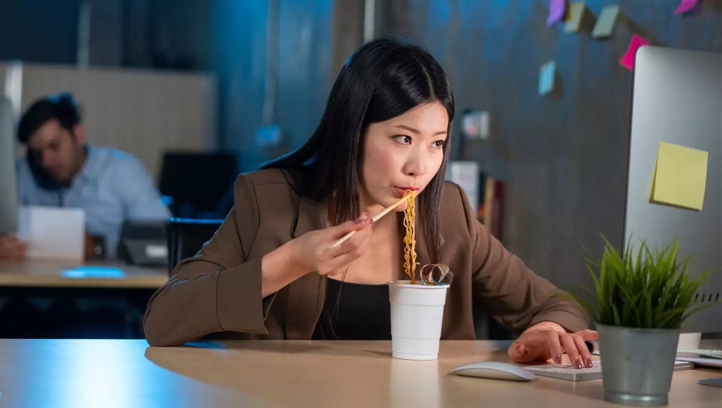 Eating at your desk could cause major stomach issues, experts have revealed (Getty Stock Image)