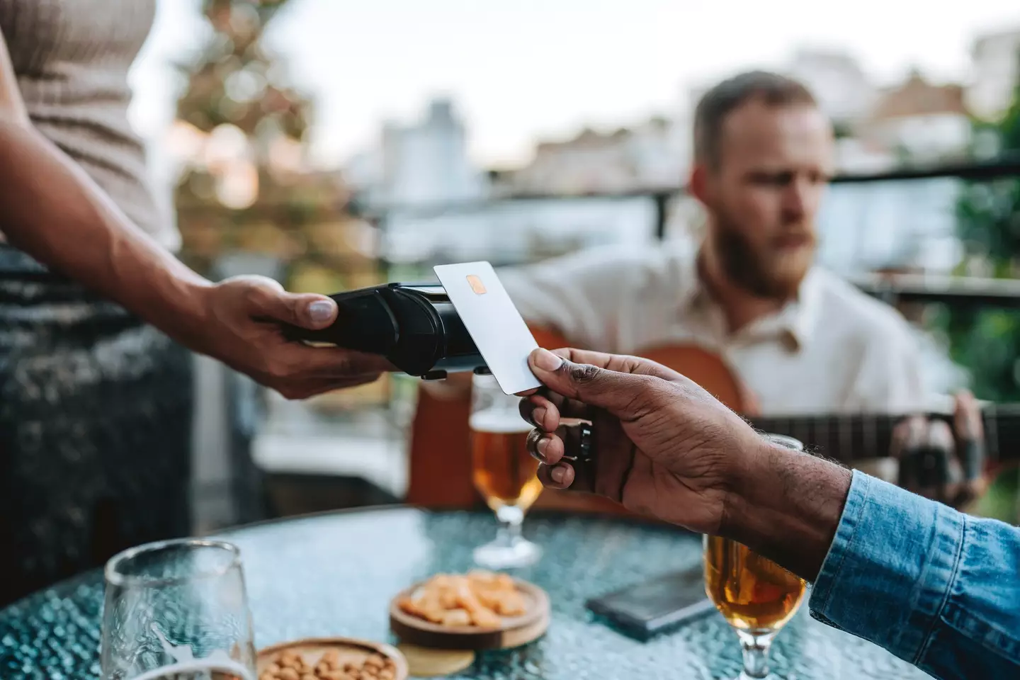 No, playing an acoustic guitar at the dinner table isn't the trick in question. Please don't do that (andreswd/Getty Images)