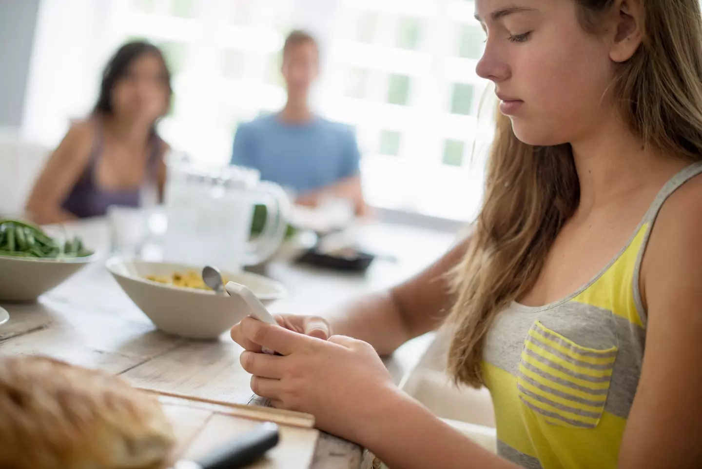 Do mobile phones belong at the dinner table? (Mint Images - Tim Robbins/Getty Images)