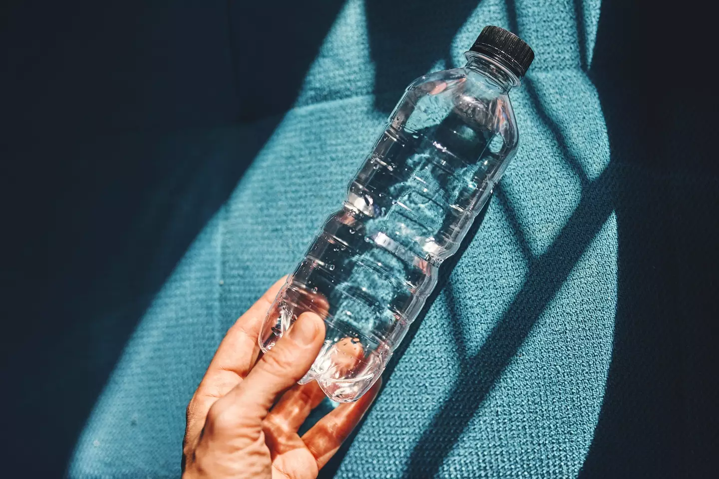 Plastic-bottled water may contain as many as 240,000 microscopic plastic particles (Ekaterina Goncharova/Getty Images)