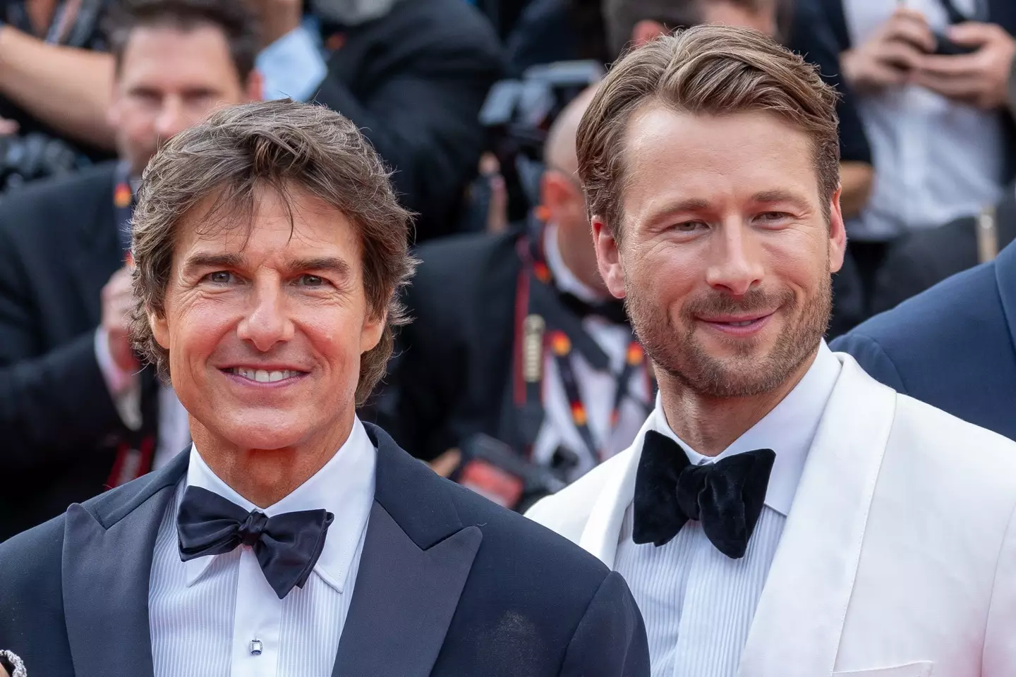 Cruise and Powell at a red carpet event for Top Gun: Maverick in 2022 (Marc Piasecki / Contributor/Getty Images)